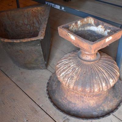 Iron urn and antique feeding trough