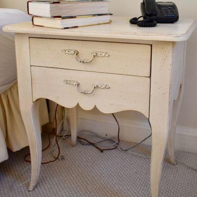 One of  a pair of painted nightstands