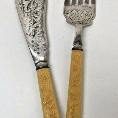 SM003: ORNATE FORK AND KNIFE SERVING SET STAINLESS STEEL AND CELLULOID   https://www.ebay.com/itm/123952007901
