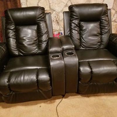Faux leather reclining theater chairs.