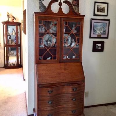 Petite Secretary, curio cabinet in background