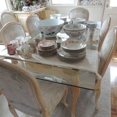 g.lass top whitewashed wood table with six fabric covered chairs