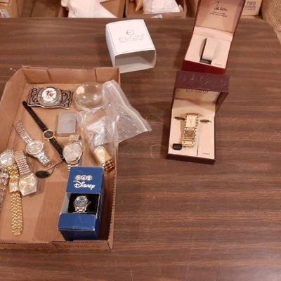 Assorted watches, zippo lighter and belt buckle