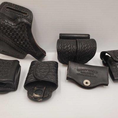 826: 6 Leather Holsters
Includes Magazine pouches, ammo holster, gun holster and cylinder holster. Brands include tex shoemaker, De...