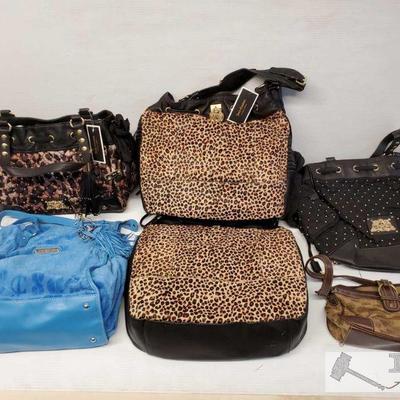 9033:	
5 Juicy Couture Purses and 1 Unbranded Handbag
Unauthenticated 5 juicy Couture Purses in various designs and one unbranded handbag