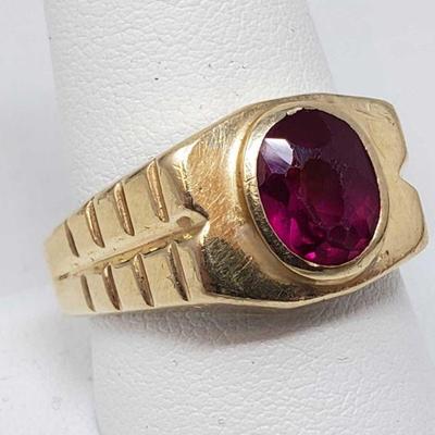 1050: 14k Gold Ring with 2.5ct Red Stone, 7.5g
Center stone approx 2.5ct, weighs approx 7.5, size 10.5