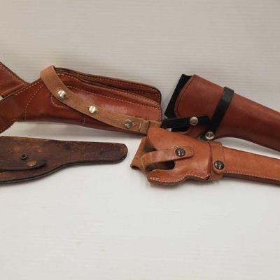 828: 4 Leather Holsters
Bramds include Hunter, Tex Shoemaker Co. and J C Higgins. Measures approx 10