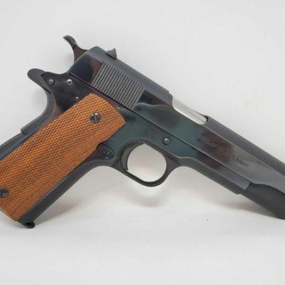 Colt 1911 US Army .45 Cal Semi-Auto Pistol with Magazine
Serial Number: 581113 Barrel Length: 5