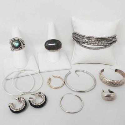 1240: Assorted Sterling Silver Jewelry - Bracelet, Two Rings, Two Pairs of Earrings and Loose Earrings
Combined weight approximately...