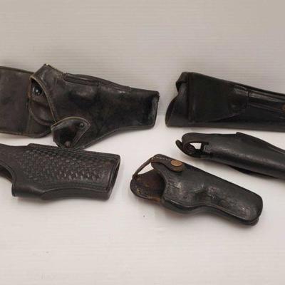 823: 5 Leather Gun Holsters
Brands include Tex Shoemaker and Son, B W M 94, Safety Speed Holster and Clark Holster. Measures approx 7