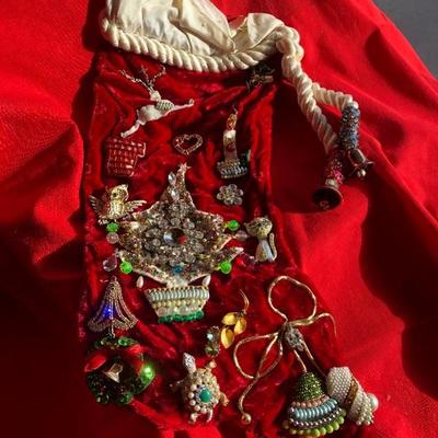 Vintage stocking with vintage broaches and pieces attached 