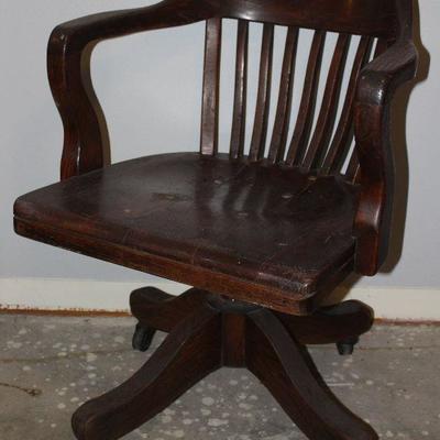 Antique solid wood judicial armchair and swivel base with original casters