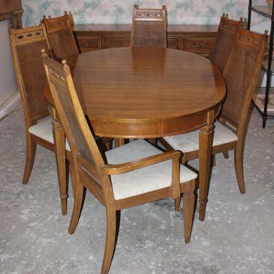 Vintage Dining Table ( 65â€ x 44â€ w/3 12â€ Table leaves) and 2 cane high back Arm Chairs and 4 side chairs 