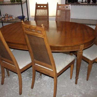 Side view:  Vintage Dining Table ( 65â€ x 44â€ w/3 12â€ Table leaves) and 2 cane high back Arm Chairs and 4 side chairs 