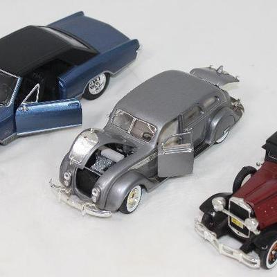 Open View of Models:   Maisto 1965 Buick Riviera Grand Sport 1/26 Model,  Signature Model 1936 Chrysler Airflow 
