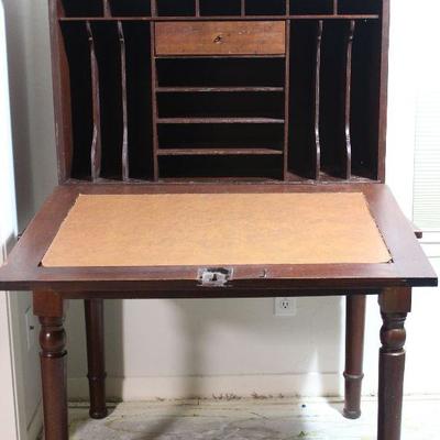  Antique plantation desk, all hardwoods, interior photo revealing cubby holes.  Front drops to create a desk top,  circa 1830-1850â€™s...