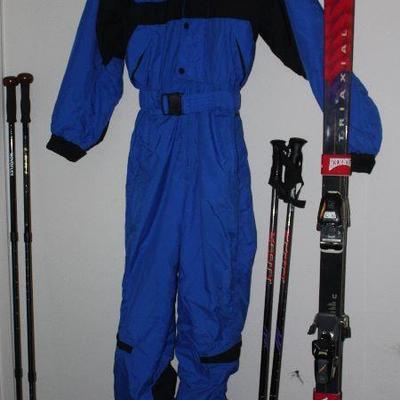 Edelweiss Blue & Black Full Body Ski Suit Shown with Triaxel Marker Snow Skis, Scott Accelerator Ski Poles and Trekking Poles:  Novoflex...