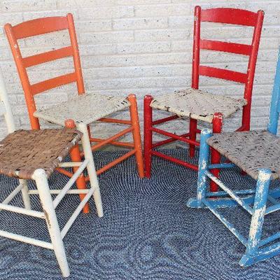 Farmhouse Ladder Back Side Chairs and one Rocker in multi colors with rush/cane woven seats.