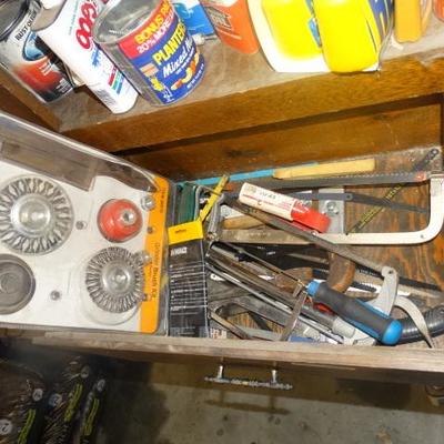 Drawer of Saws, saw blades and wire brushes