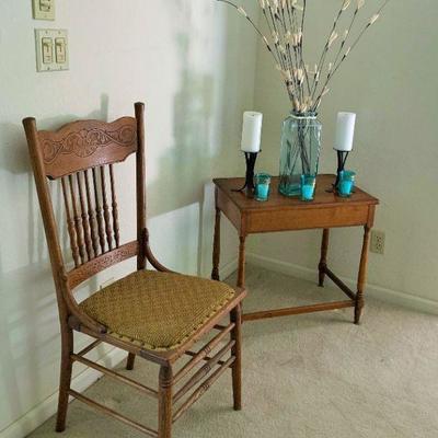 Double pressed back chair that goes with Dining room and antique side table