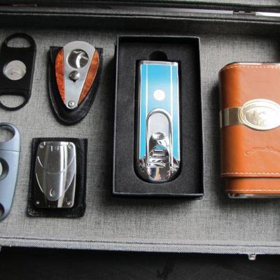 For the distinguished gentleman, a nice collection of cigar cutters, lighter, and cases. As well as 2 humidors that every man should have.