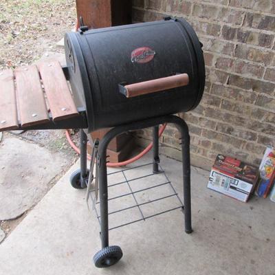Charcoal grill w/ accessories inside