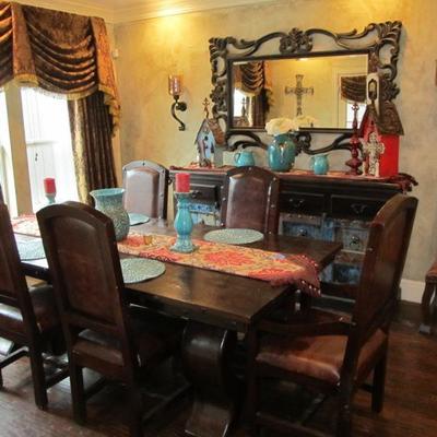 Exquisite & fine-detailing fit the bill of this large dining table ready for any fine estate.  Leather chairs w/ metal finery