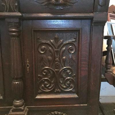 Detail close-up of antique oak highly carved buffet