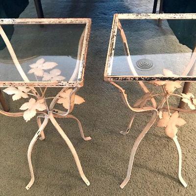 Pair of matching glass top small wrought iron tables