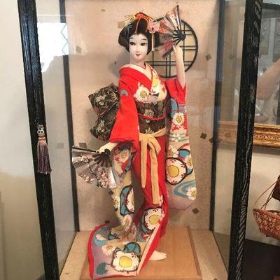 Oriental doll in case