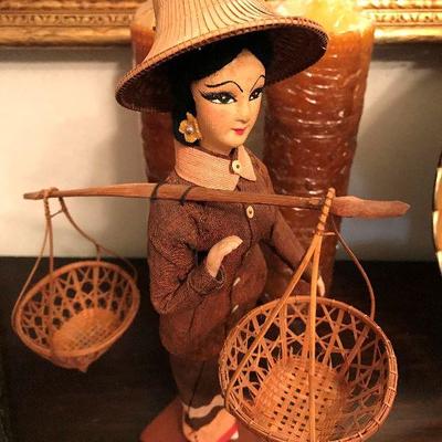 Oriental doll with baskets