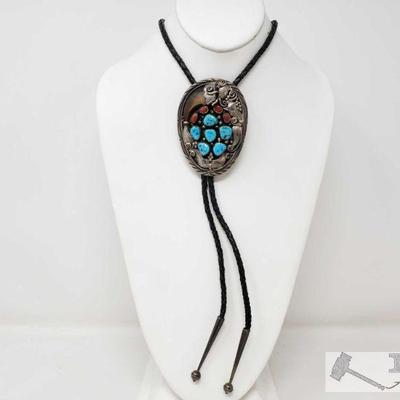 Turquoise and Coral Sterling Silver Native American Bolo Tie, 70g
This bolo tie measures approximately 16.5in And weighs approximately...