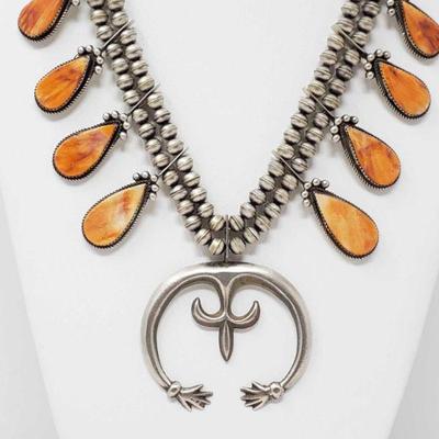 Navajo Orange Spiny Squash Necklace Signed By Selena Warner, 99.3g,
Orange Spiny Oyster and Sterling Silver Squash Necklace. Handmade by...