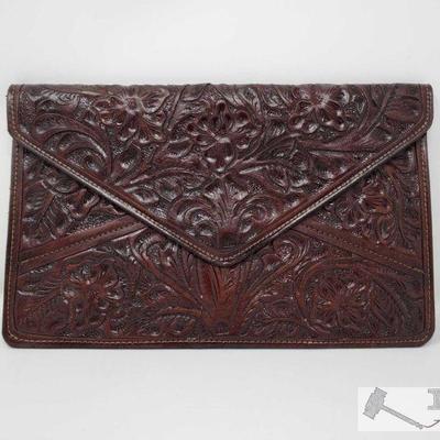 Never Carried Tooled Leather Clutch, 378.8
This beautiful tooled leather clutch measures approximately 12.5in by 8in and weighs...