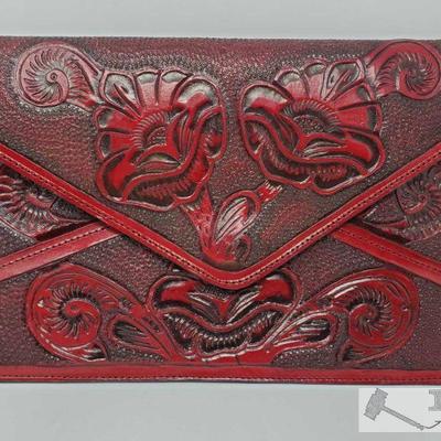 Never Carried Tooled Leather Clutch, 362.8
This beautiful tooled leather clutch has never been carried! It weighs approximately 362.8g...