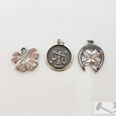 Three Pendants, 6.1g
This collection contains two leaf shaped Pendants and one zodiac pendant. Two are marked Sterling Weighs all...