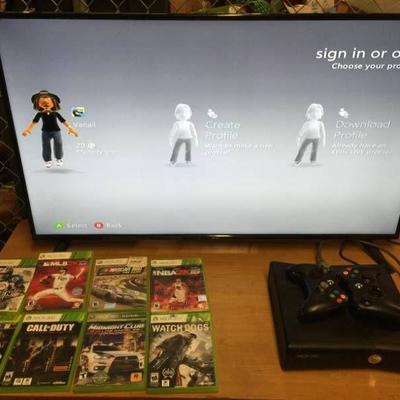 XBOX 360 with 2 Controllers and 8 Games