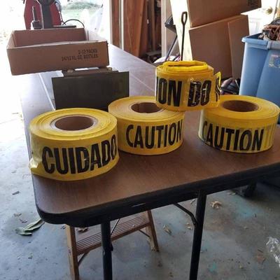 #three rolls of caution tape and small roll of caut ...