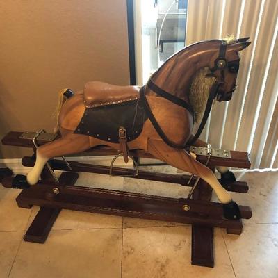 Hand made solid wood rocking horse retail value is over $3,000 