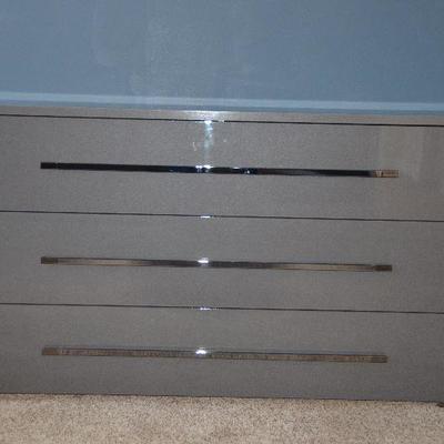 Item #6 Long Dresser with Mirror (Never installed!)  
(Part of matching bedroom set) 
Beautiful Gloss Gray! Very trendy and stylish. Has...