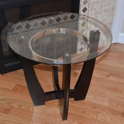 Item #8 1 of 2 Round Glass Top End Tables 
Beautiful Very trendy and stylish. 26
