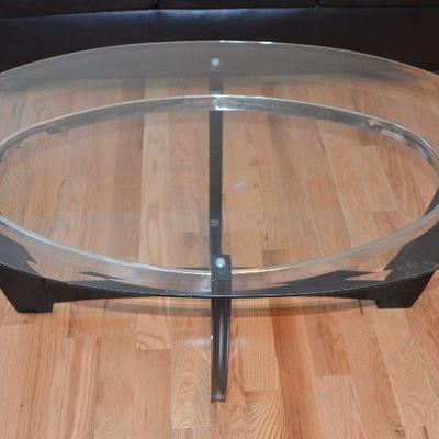 Item #9 Long Oval Glass Top Coffee Table 
Beautiful Very trendy and stylish. 48