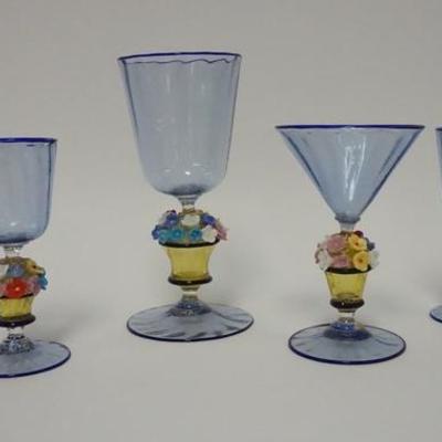 1013	FOUR PIECE ITALIAN LIGHT BLUE BLOWN GLASS STEMWARE W/ FLOWER POT STEMS, ONE FLOWER IS CHIPPIED ON THE CONICAL PIECE, FEET HAVE GOLD...
