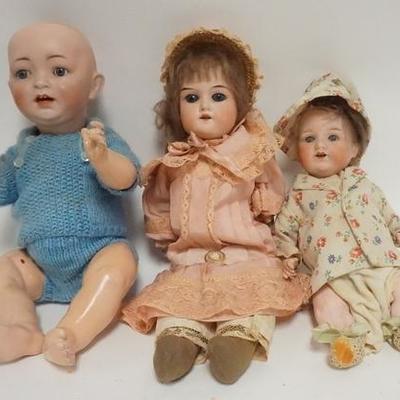 1091	GROUP OF THREE GERMAN BISQUE HEAD DOLLS, TALLEST IS 13 IN H 
