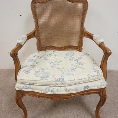 1064	CARVED FRENCH STYLE CANE BACK ARM CHAIR W/ UPHOLSTERED SEATS AND ARM RESTS 
