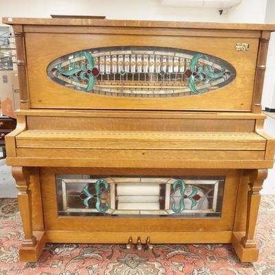 1029	SCHAFF BROTHERS PLAYER PIANO, HAS VARIOUS INSTRUMENTS & LEADED GLASS PANELS TOP & BOTTOM, OAK CASE, HAS A 25C COIN SLOT W/ROLLS
