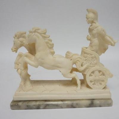 1082	ARTIST SIGNED COMPOSITION STATUE OF A WARRIOR IN A CHARIOT, MOUNTED ON A MARBLE BASE, 9 1/2 IN W 9 1/4 IN H 
