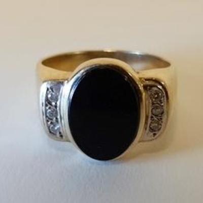 1007	14K GOLD RING WITH OVAL BLACK STONE FLANKED BY 6 SYNTHETIC DIAMONDS. TOTAL WEIGHT 5.25 DWT
