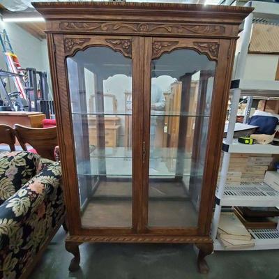 2004: Antique Tiger Oak Cabinet w/ Glass Shelves and Carving
Cabinet measures approx. 42.5