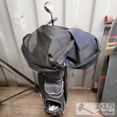 8522: Walter Hagen Golf Caddy Bag, 3 Wilson Clubs, Various Golf balls
Walter Hagen bag has Various Sized lockets and also has built in...